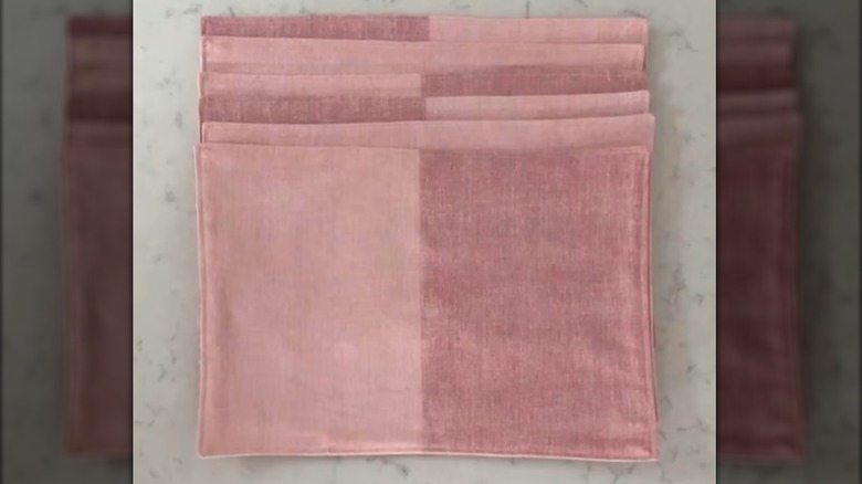 Pink color block placemats made from curtain fabric on stone countertop