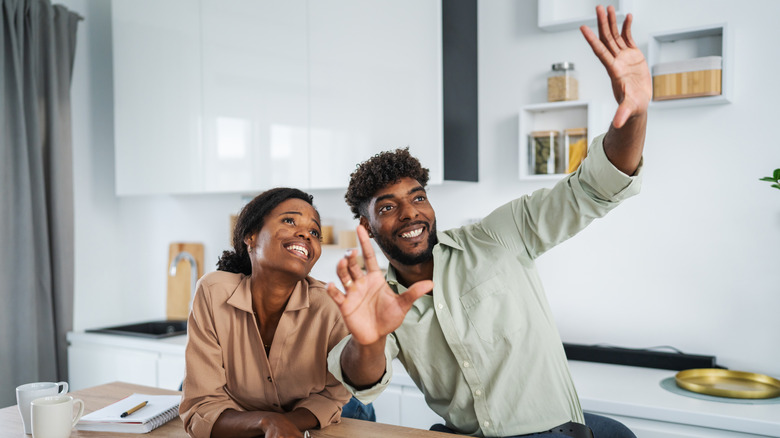 A couple imagining their kitchen design together