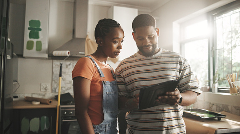 A couple planning their kitchen design