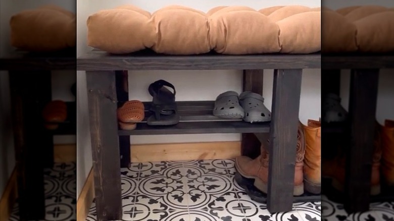 Woman sitting on finished bench with shoe rack