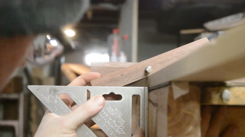 Marking angle location on flip-down coat rack