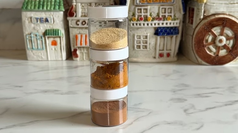 Jars with white lids filled with spices