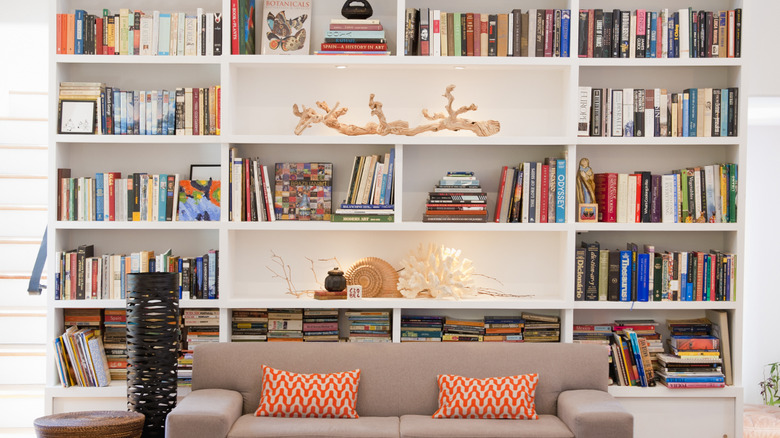 white bookcase horizontal and vertical stacks
