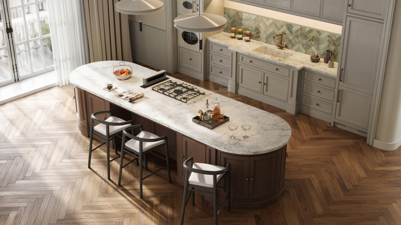 a modern kitchen with rounded central island