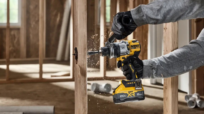 Drilling into a wall stud with a DeWalt DCD1007 hammer drill