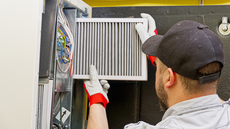 Man changing an HVAC filter