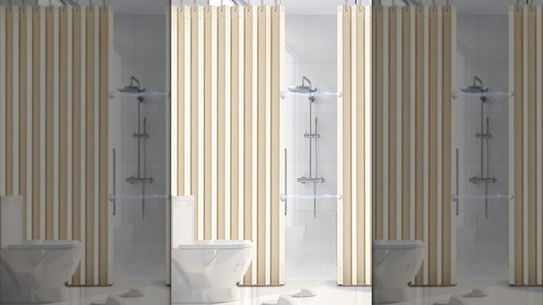 A heavy-duty off-white shower curtain in front of a white shower and white toilet