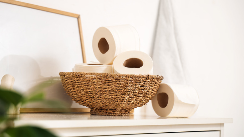 Toilet paper cluttering a basket