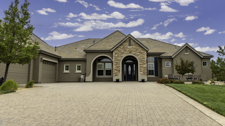 House with a brick driveway