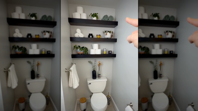 Woman pointing at modern DIY floating shelves above toilet tank with bathroom decor