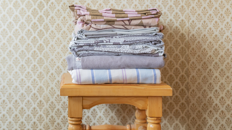 Pile of old sheets sitting on a table