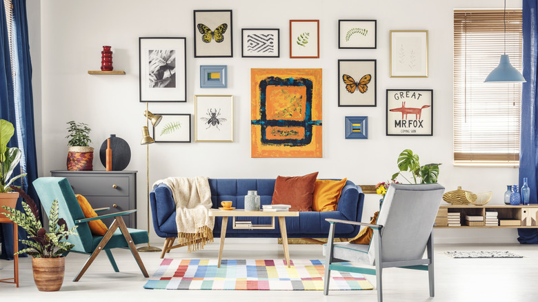 A gallery wall with different photographs framed and displayed