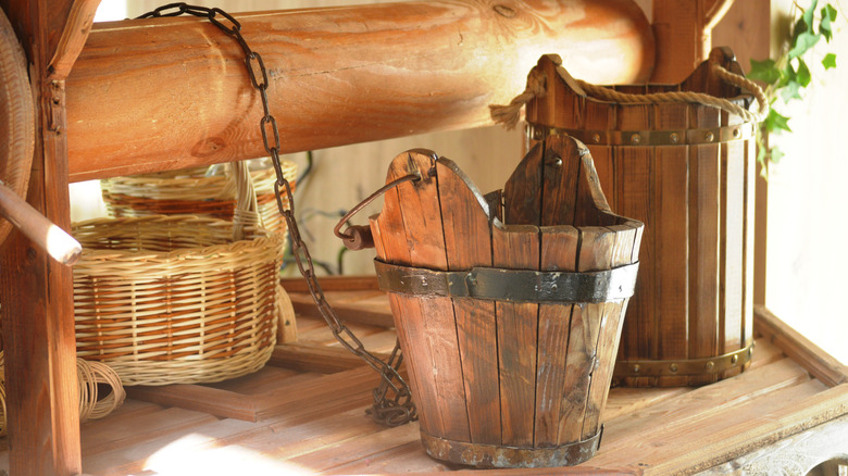 Two vintage wooden buckets in different sizes