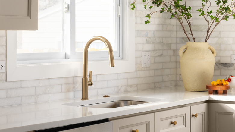 Kitchen with a white subway tile backsplash