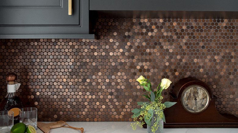 Kitchen with a copper penny tile backsplash