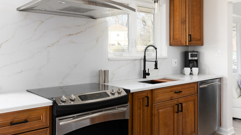 Kitchen with a marble backsplash