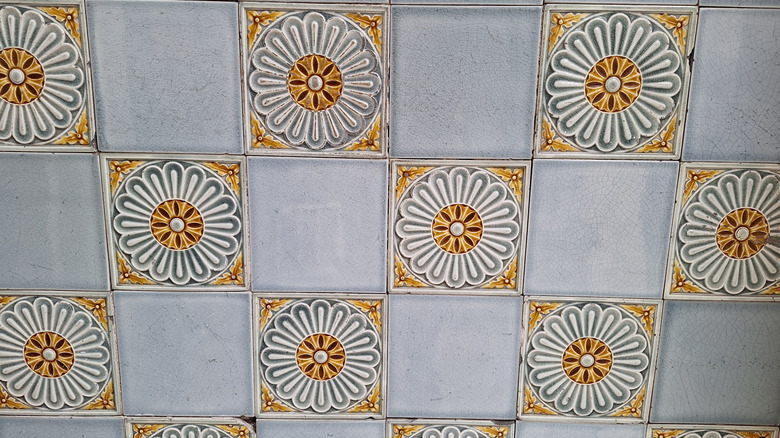 White and gold floral relief tiles