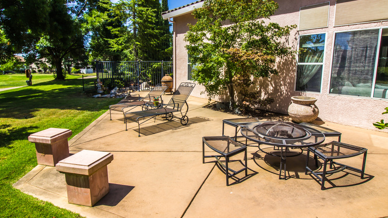 Tables and chairs on a concrete patio