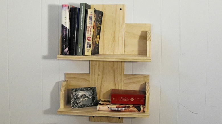 Front view of a DIY bookcase with books and decor