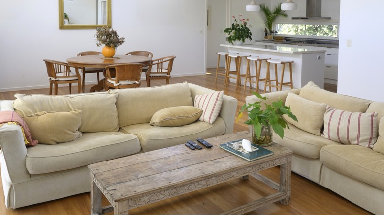A modern living room with a plain wooden coffee table
