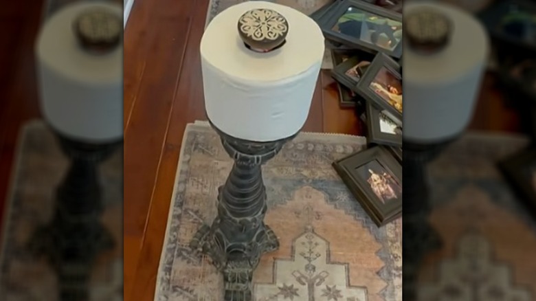 Wood toilet paper holder made from a pillar candle holder