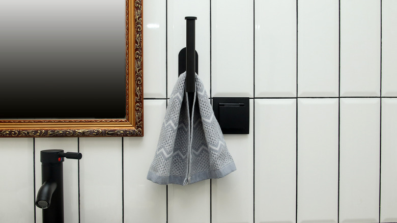 Hand towel on matte black towel holder