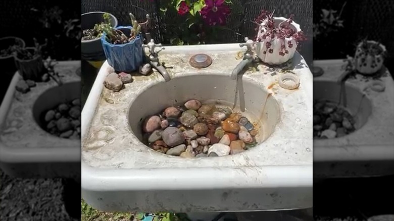 old sink basin converted to bird bath