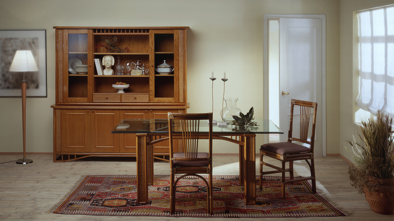 Traditional wood cabinet in background of contemporary rustic dining room
