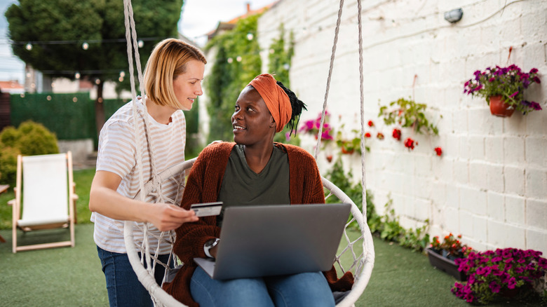 People shopping online in a backyard