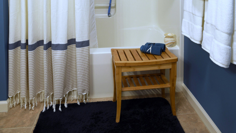 Blue and white bathroom with a cotton shower curtain