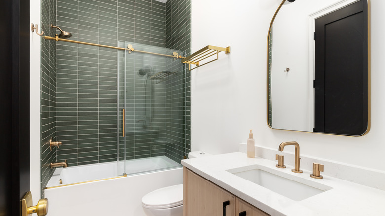 Bathroom with an over bath shower screen