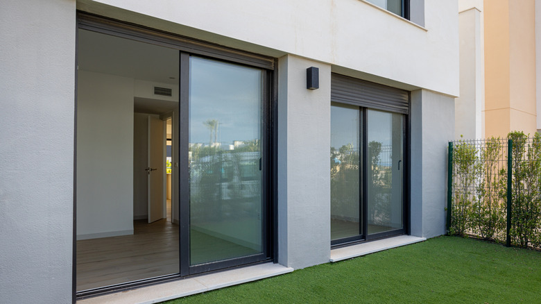 Sliding doors with black roller shades