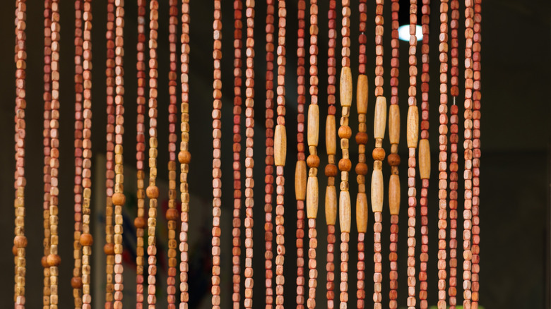 close-up of beaded curtain strands made with wood beads