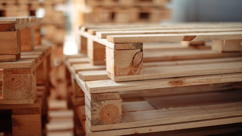 Wood pallets stacked in a warehouse