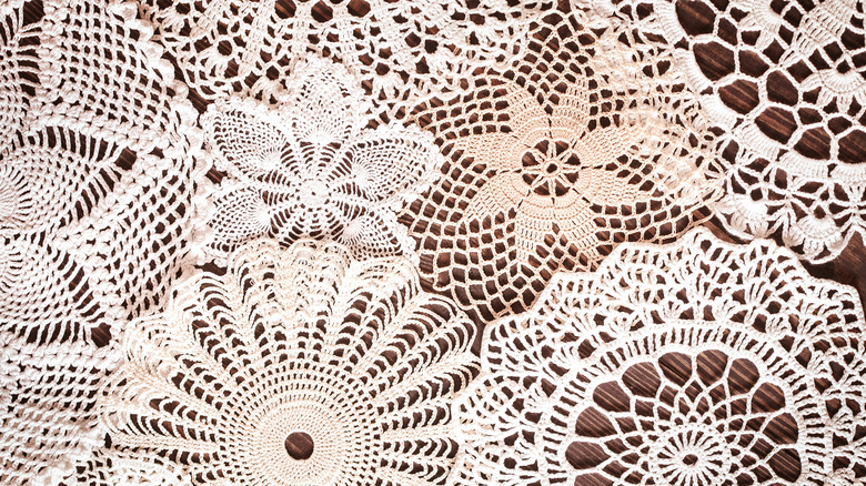 Crocheted doilies on a wooden table