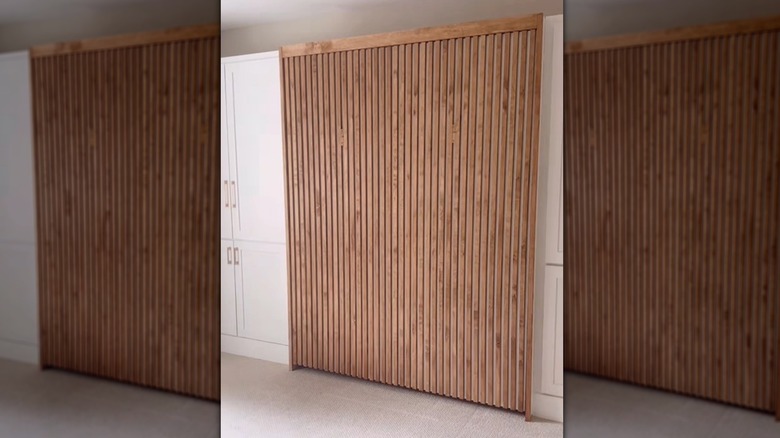 Accent wall with fluted board and large mirror