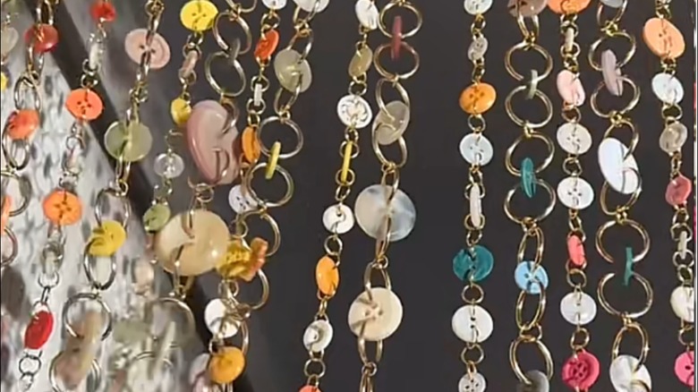 Curtain made of buttons and metal rings
