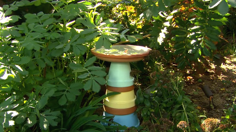 A DIY birdbath made from old planters