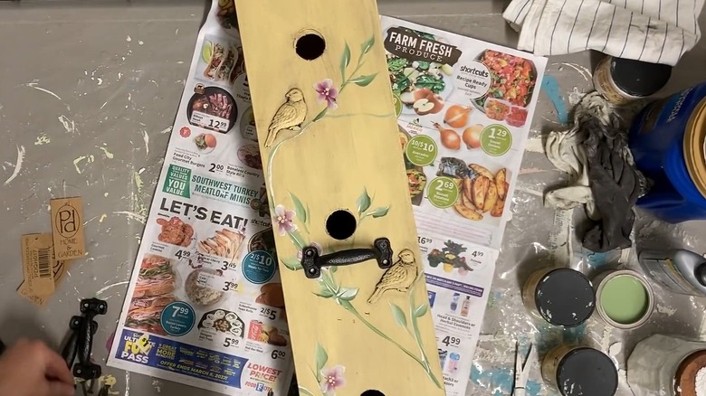 A DIY birdhouse made from an old wooden box