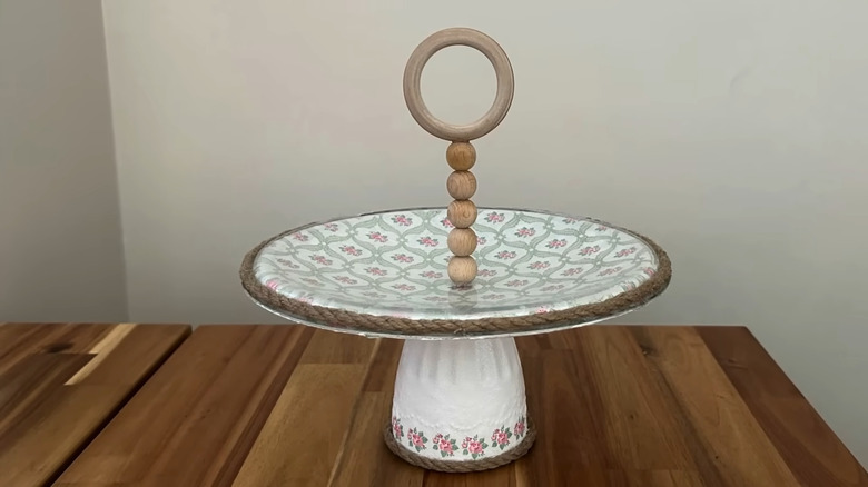 DIY storage stand made from an old pot lid an a cup