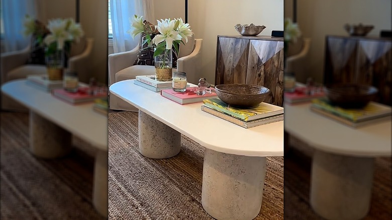 DIY coffee table with planters as legs and a wood top
