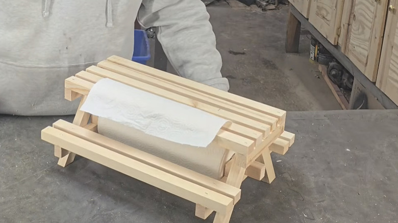 DIY wooden picnic table paper towel holder.