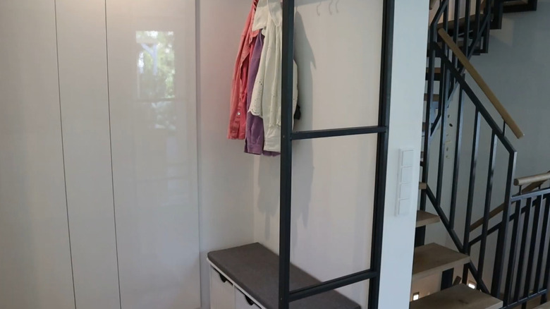 A room divider made out of a window in a room.