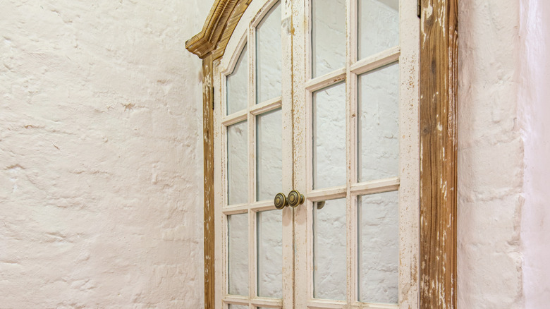 A mirror made out of a large window.