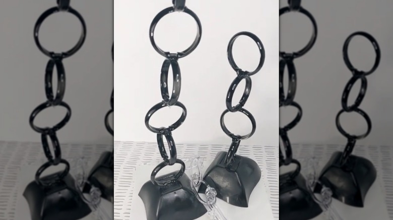 Art made from shower curtain rings painted black