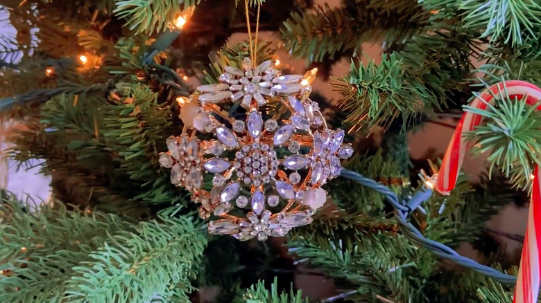 a 3D ornament made from repurposed brooches