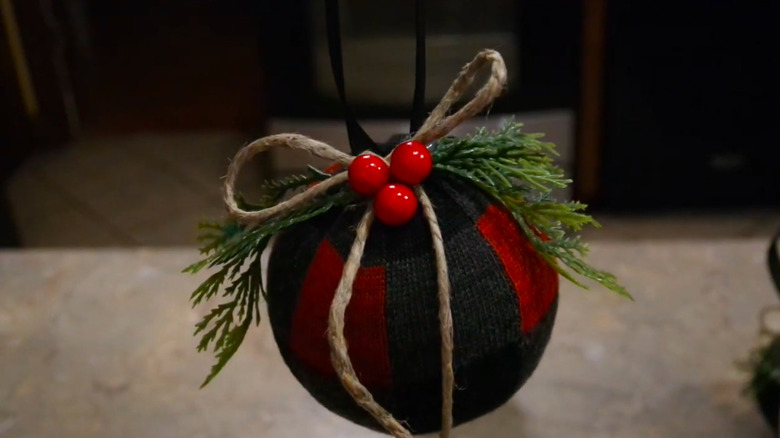 a Christmas ornament made from a ball and a sock