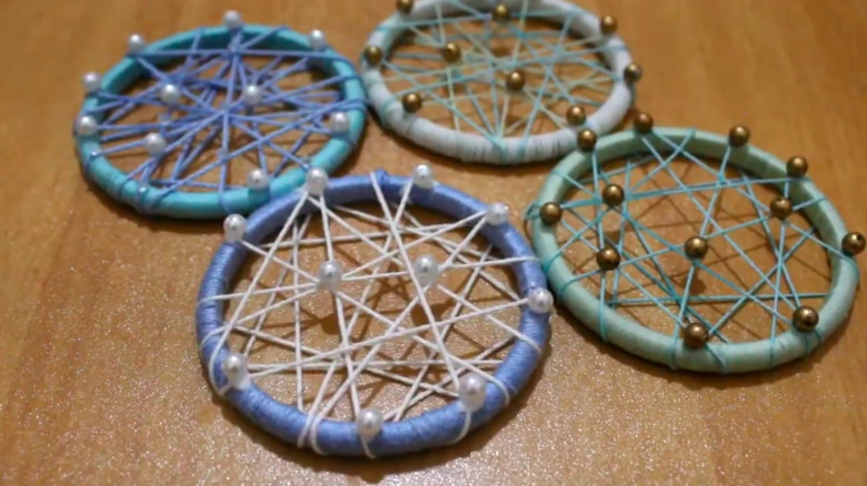 circular ornaments made from bangle bracelets and string