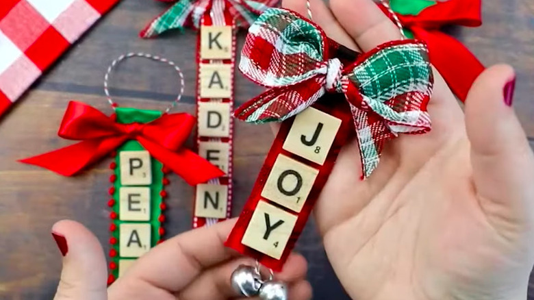 tree ornaments crafted from Scrabble tiles and ribbon