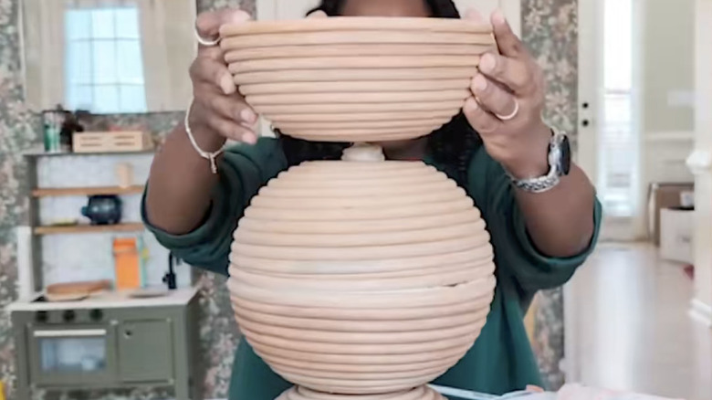 woman gluing IKEA bread baskets together